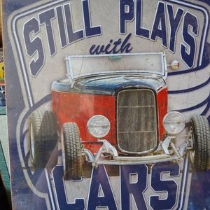 Still Plays with Cars metal sign
